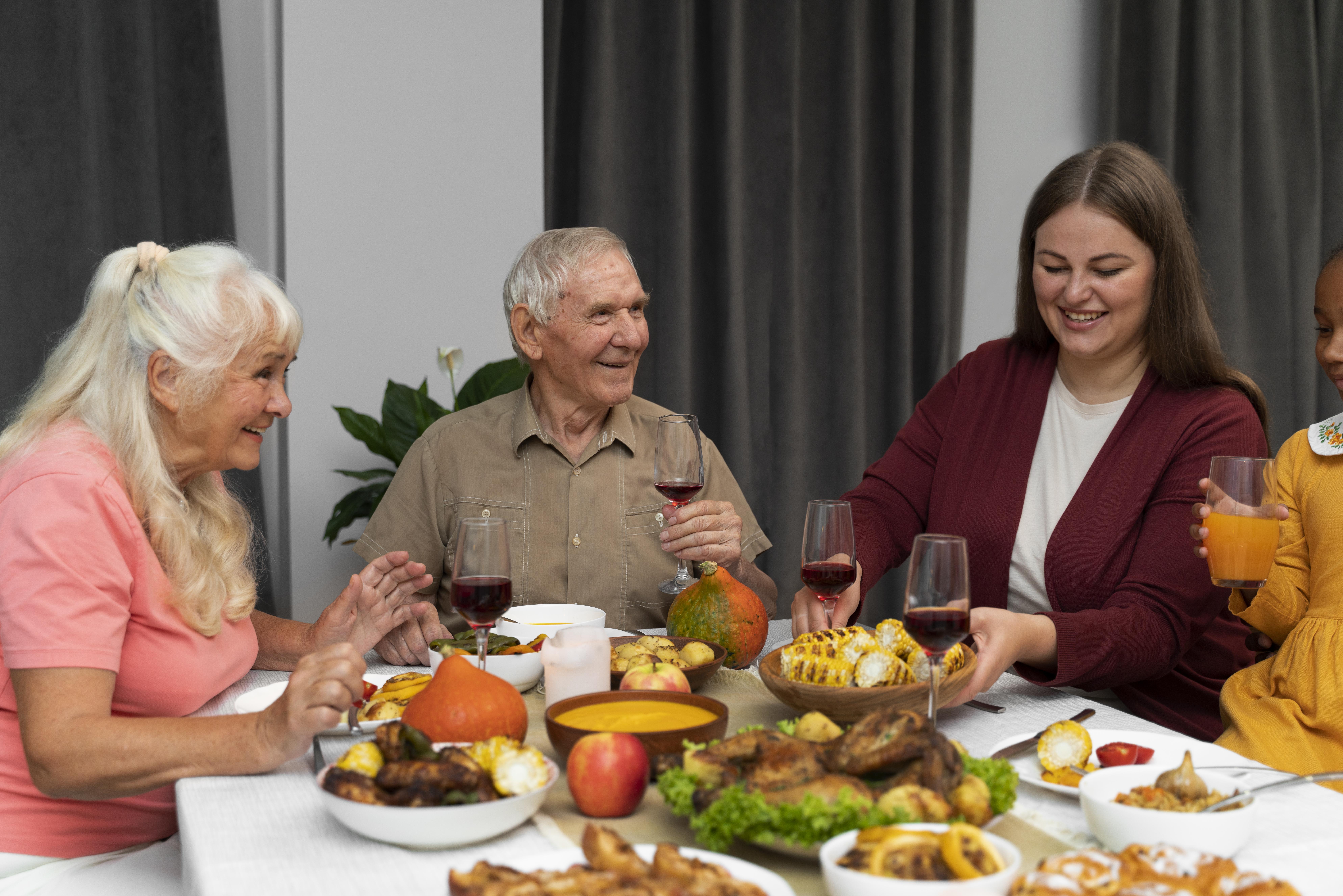 Residents sharing a family-style dinner