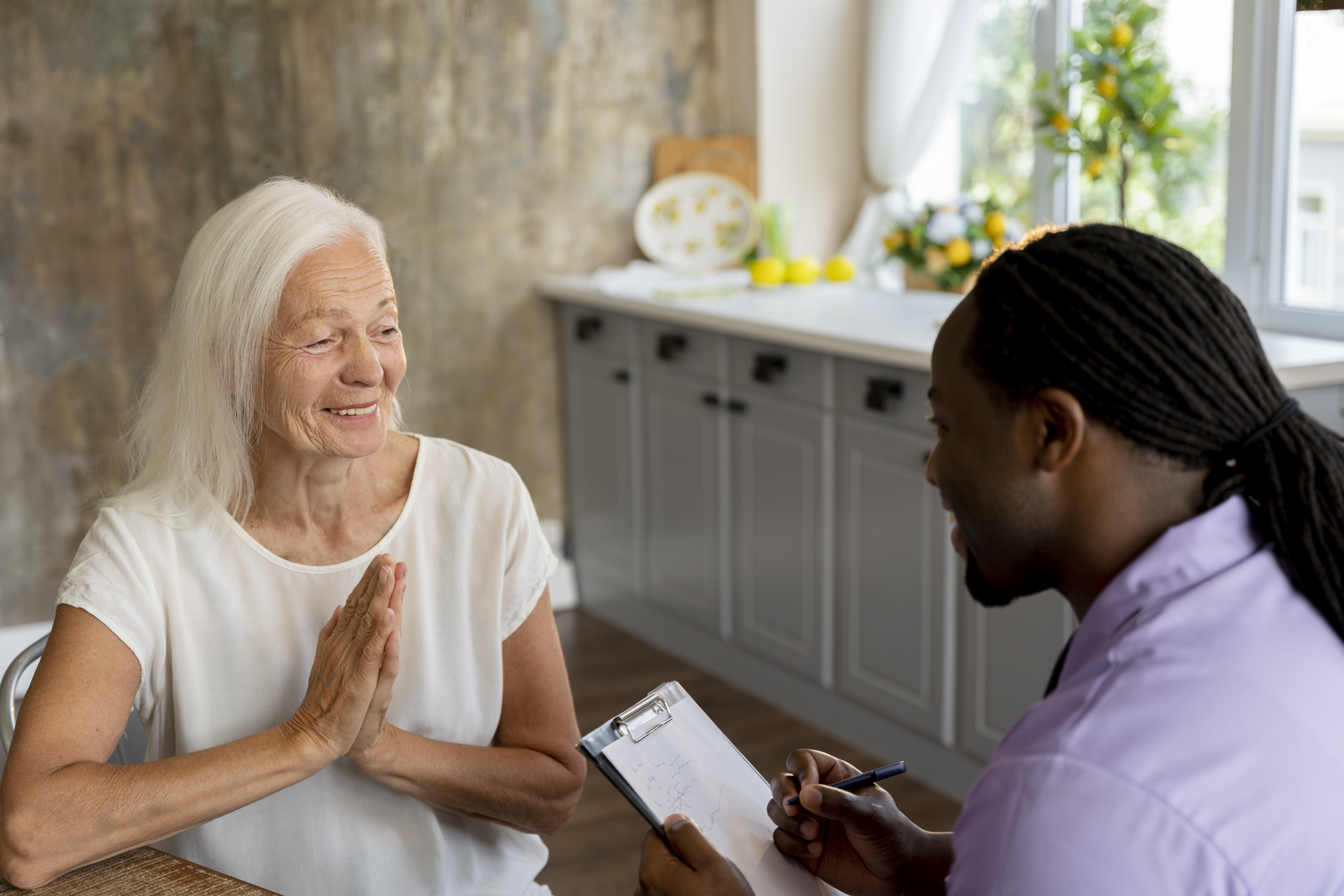 Caregiver speaking with a resident in the living area